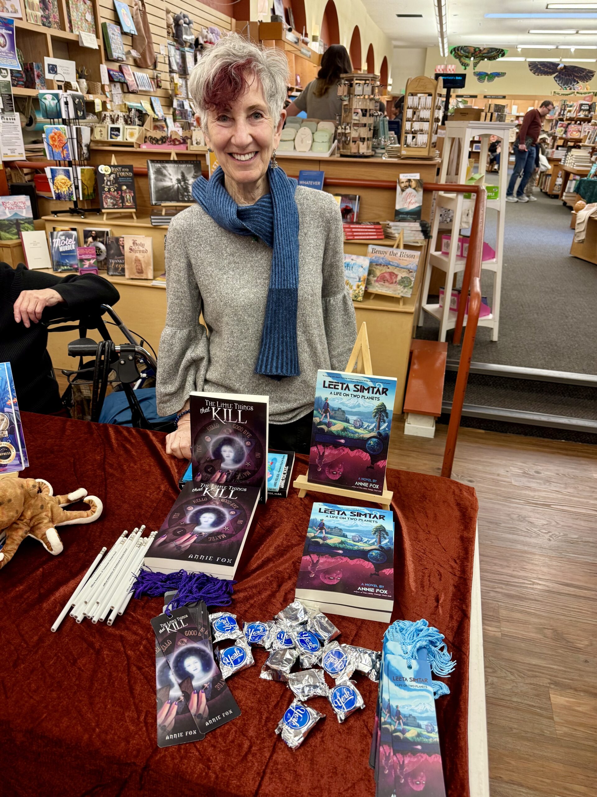 Annie Fox in front of her YA novels at Copperfield's Books in Calistoga, CA
